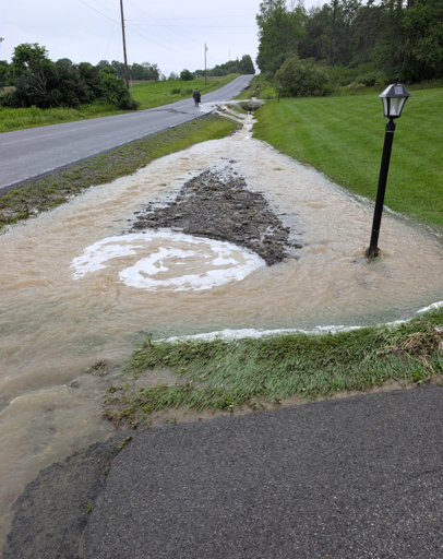 Rain dramatically overwhelming culvert